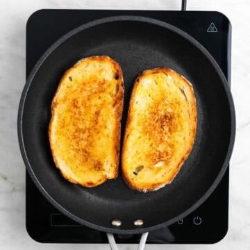 Golden brown bread slices in a skillet.