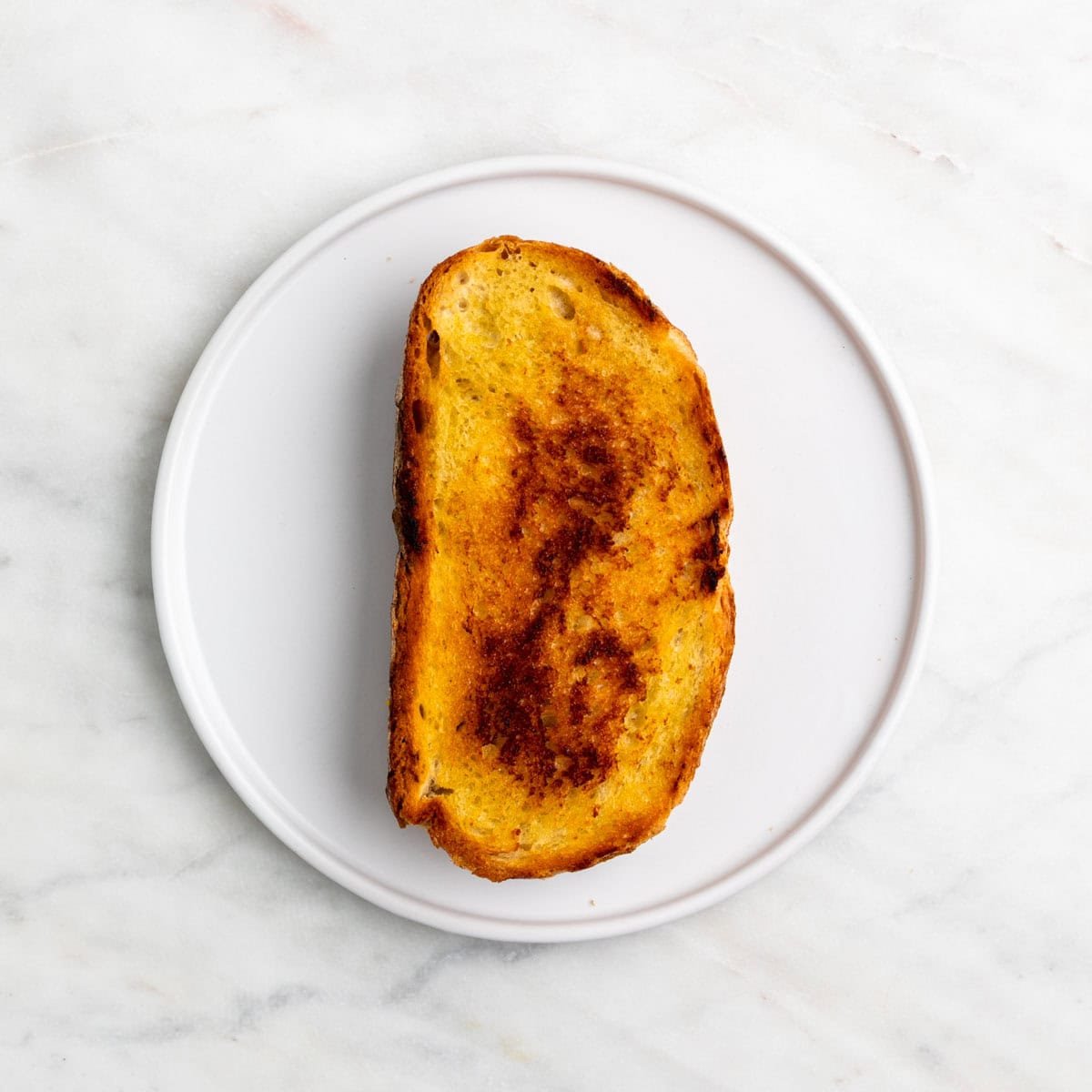 Vegan grilled cheese sandwich on a plate.