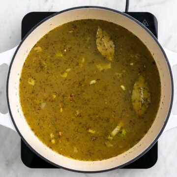 Split pea soup ingredients mixed in a pot.