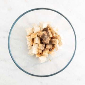 Tofu with soy sauce and spices in a bowl.