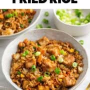 Tofu fried rice served in bowls with scallions.