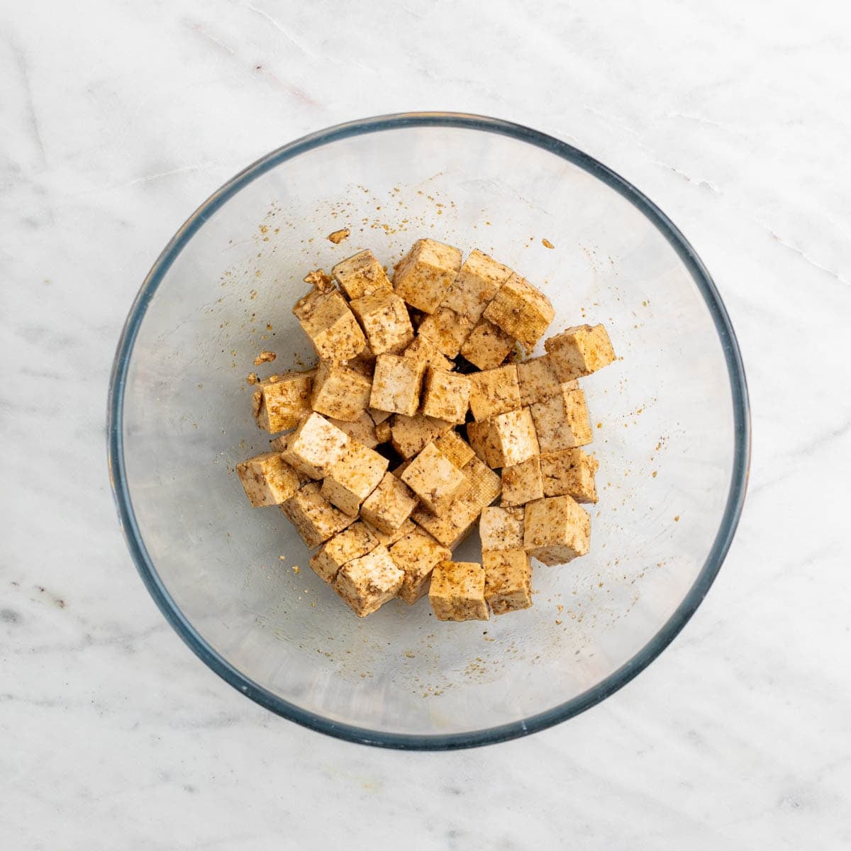 Tofu cubes mixed with soy sauce and spices.