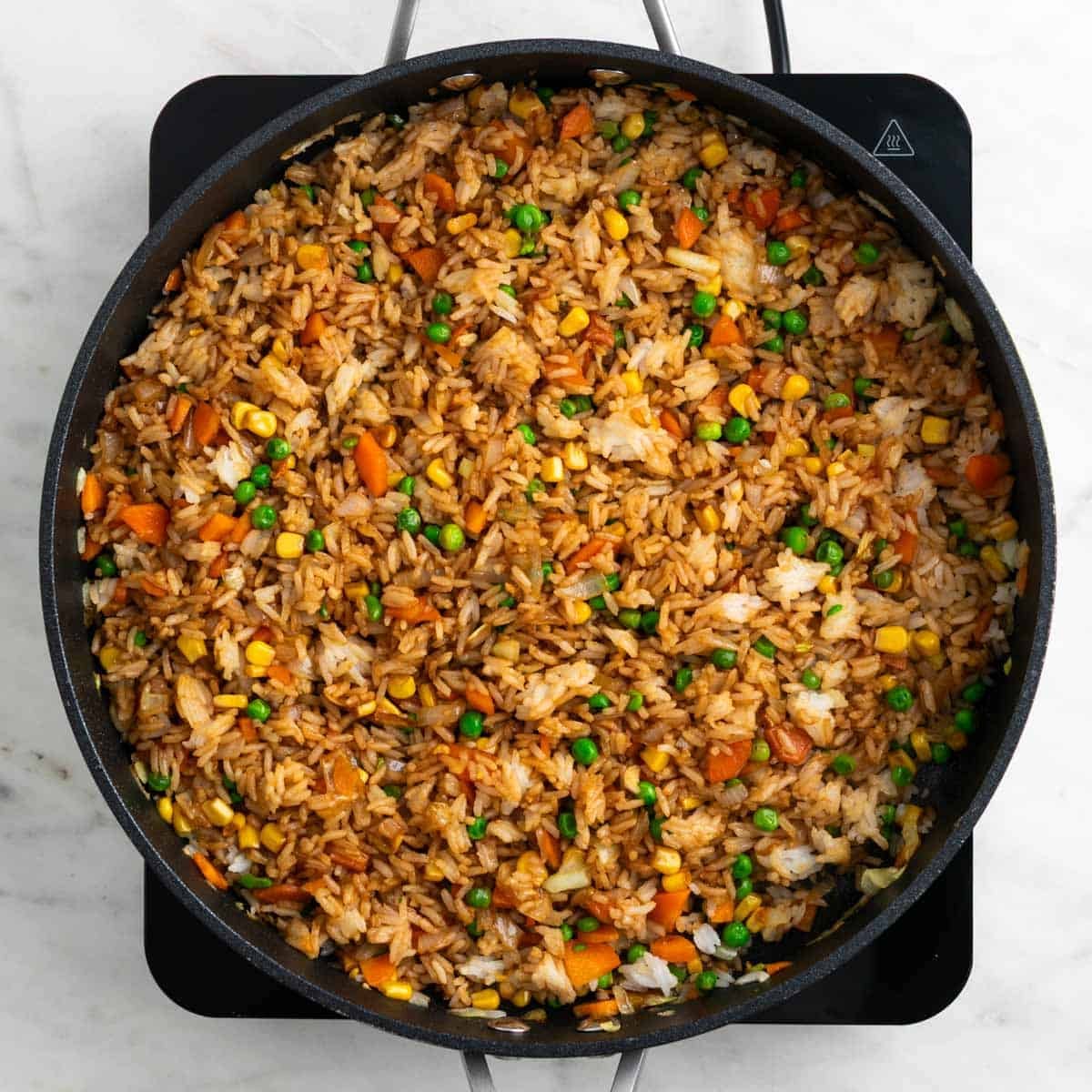 Fried rice mixed with soy sauce and sesame oil.