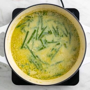Cooked asparagus soup in a pot.