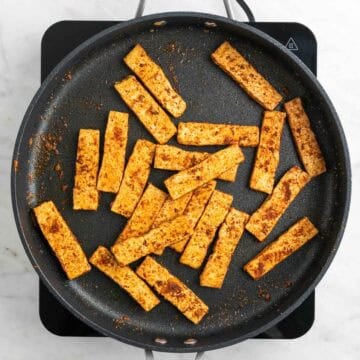 Tofu cooked with spices in a skillet