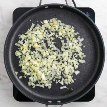 Chopped onion cooking in a skillet