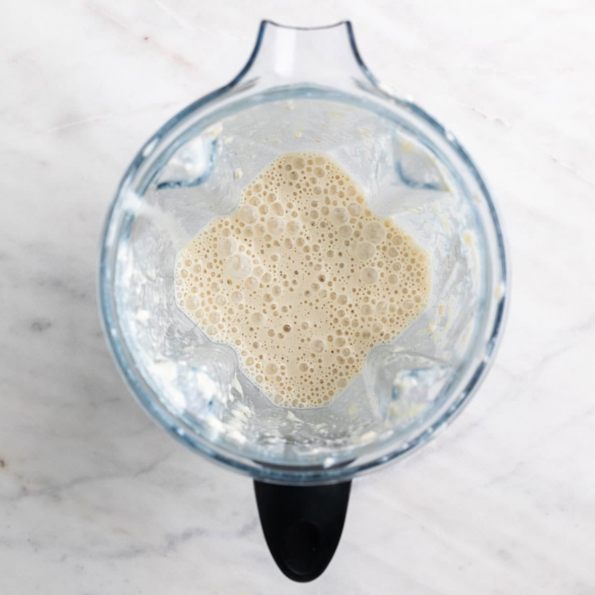 Tofu pasta sauce blended in a blender jar