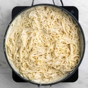 Pasta and sauce mixed together in a skillet