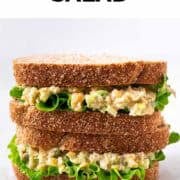 Chickpea salad sandwich with lettuce filling, cut in half and layered
