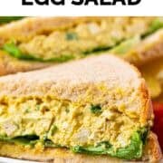 Plate with two vegan egg salad sandwiches with lettuce