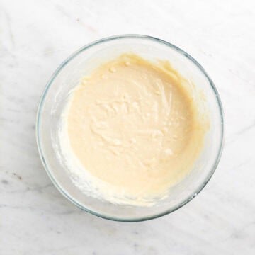 Vegan lemon cake batter in a bowl before adding blueberries