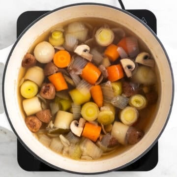 Homemade vegetable broth cooking in a pot