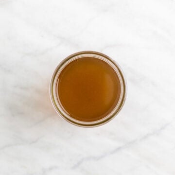 Homemade vegetable broth in a glass jar