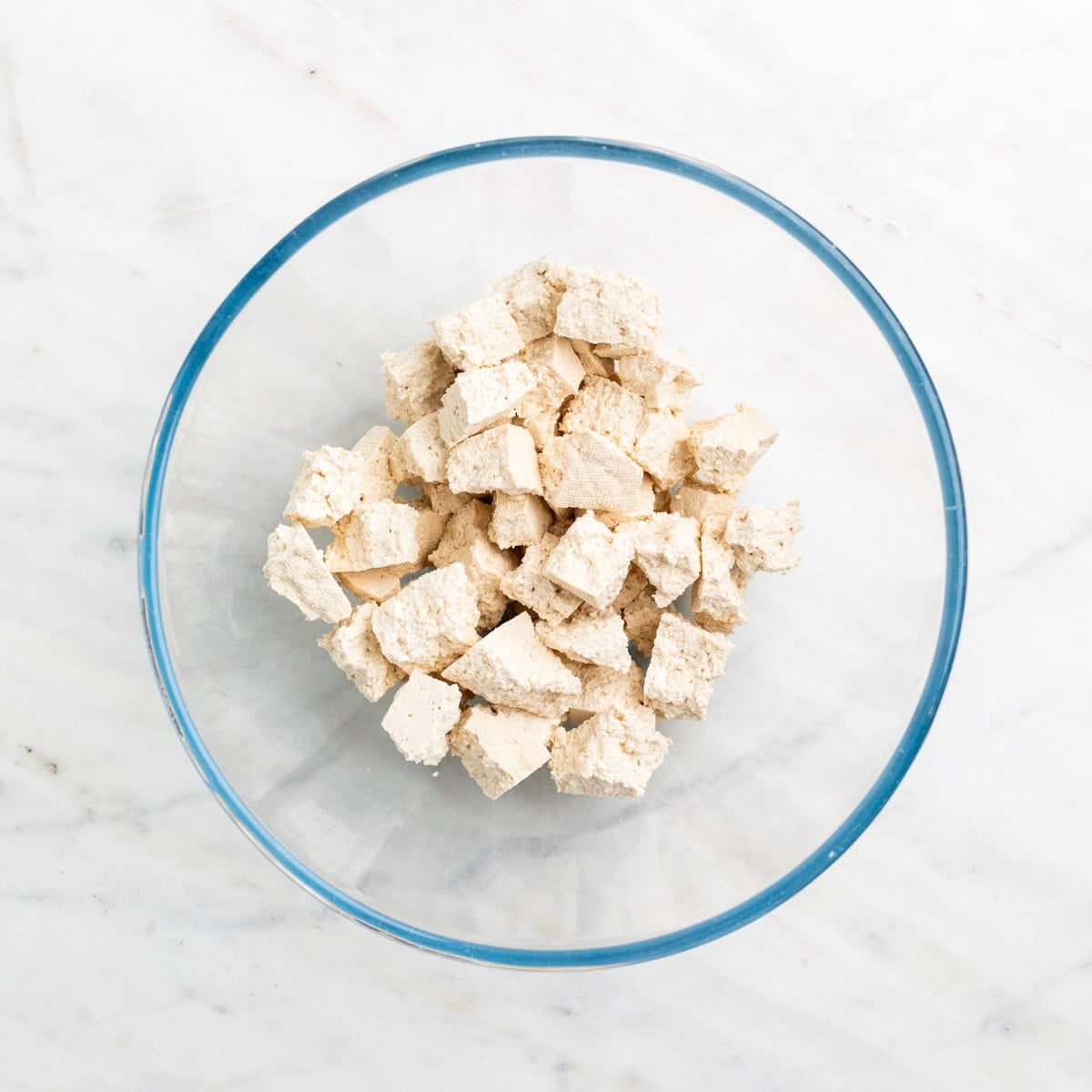 Torn tofu pieces in a bowl