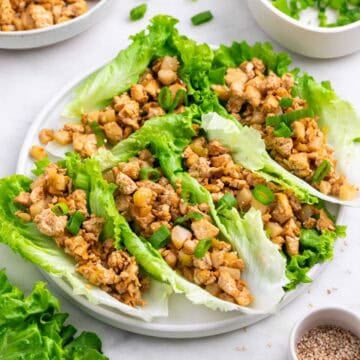 Tofu lettuce wraps served with extra filling and toppings on the side