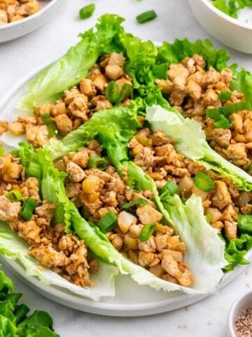 Tofu lettuce wraps served with extra filling and toppings on the side