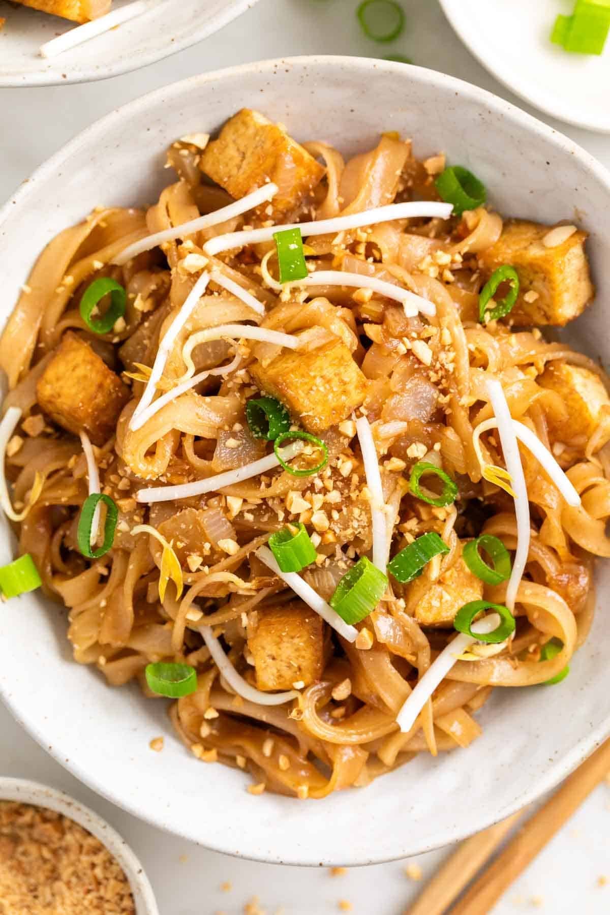 Vegan tofu pad Thai with rice noodles, tofu, peanuts, and fresh bean sprouts