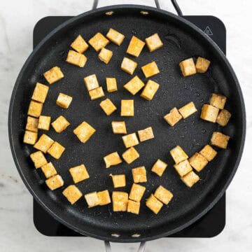Tofu cooking in a skillet