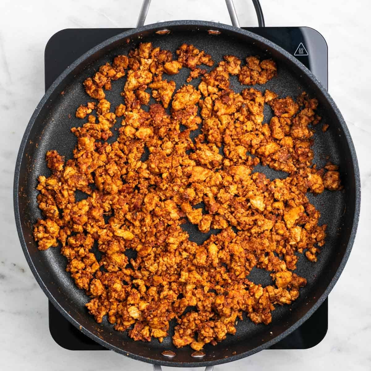 Tofu taco meat fully cooked in a skillet
