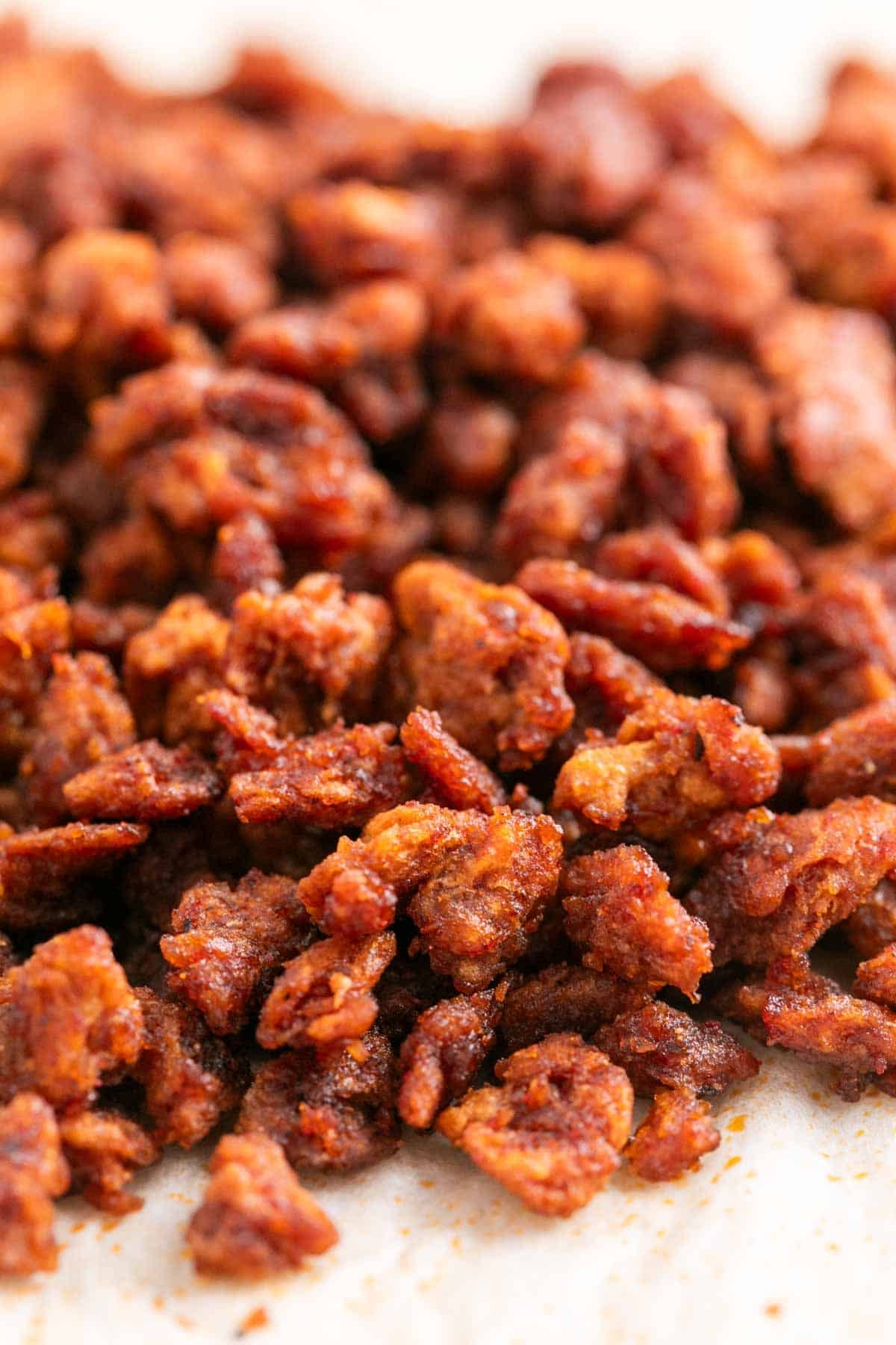 Close-up of homemade vegan bacon bits on parchment paper