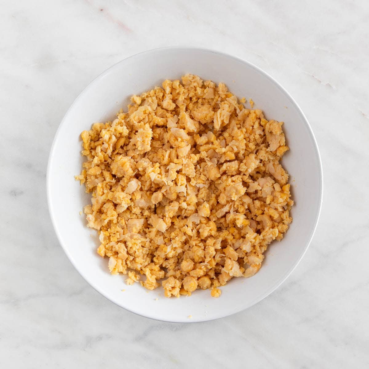 Mashed chickpeas in a shallow dish