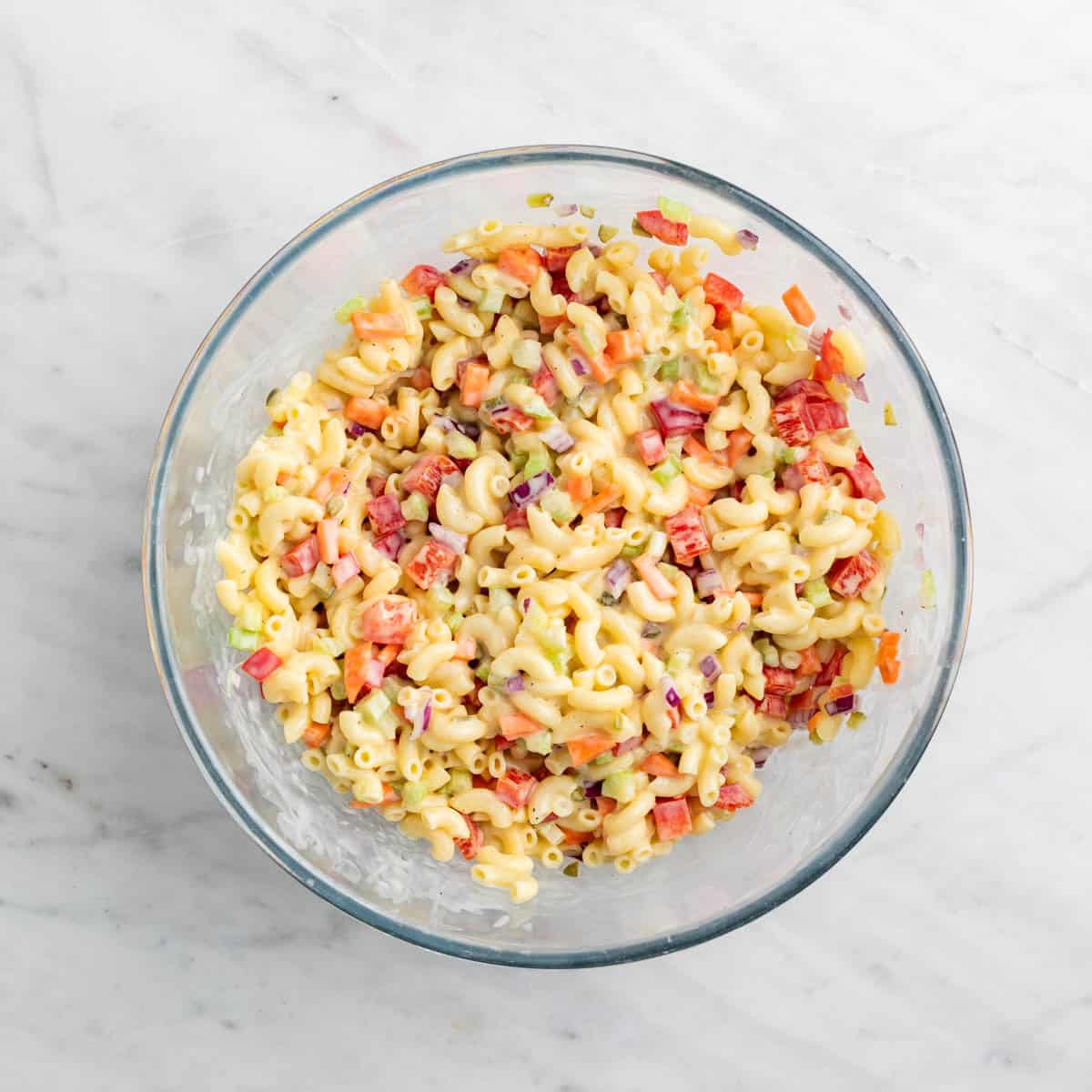 Vegan macaroni salad mixed in a large bowl