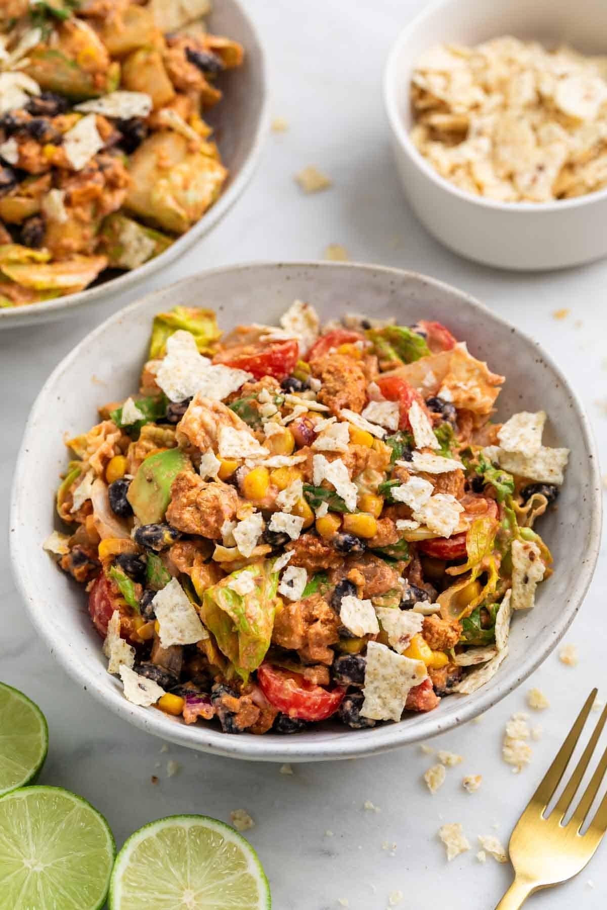 Vegan taco salad with tofu taco meat and crushed tortilla chips