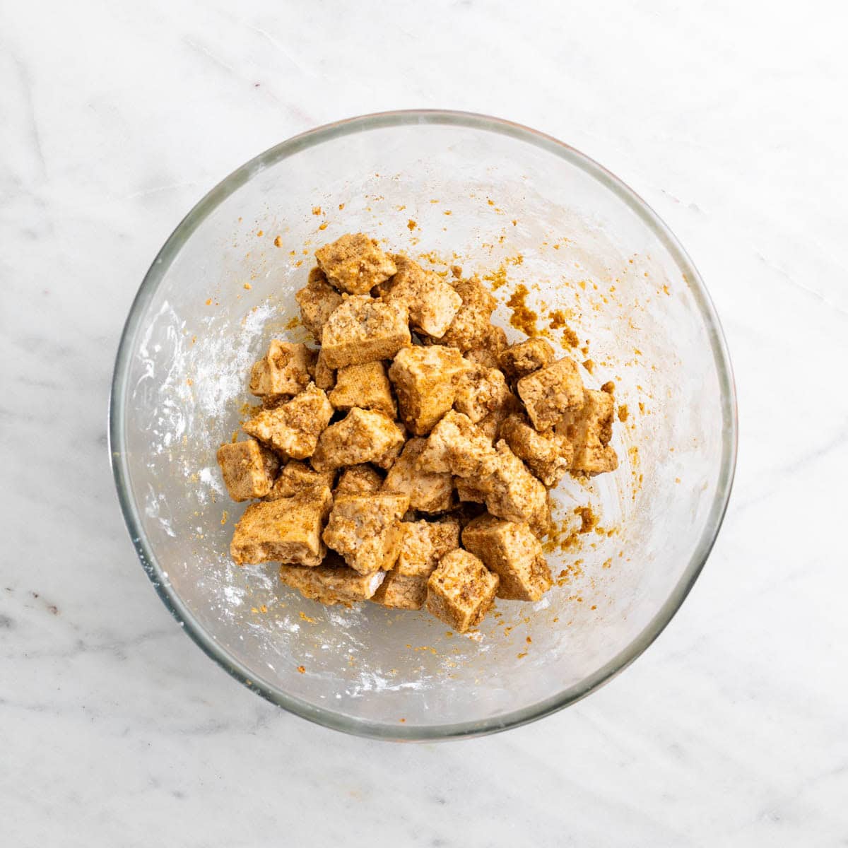 Tofu coated with cornstarch, chicken seasoning, and spices