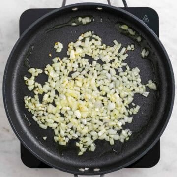 Onion cooking in olive oil in a large skillet