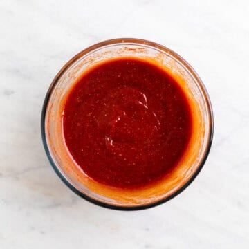 Vegan BBQ sauce ingredients whisked together until smooth in a bowl