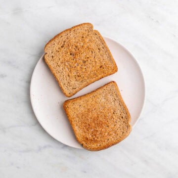 Two slices of bread toasted until lightly golden