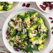 Homemade vegan broccoli salad with a fork and simple toppings