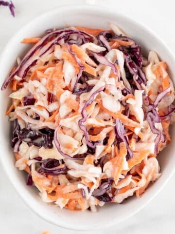 Close-up of creamy vegan coleslaw in a bowl