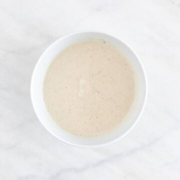 Vegan coleslaw dressing mixed in a small bowl