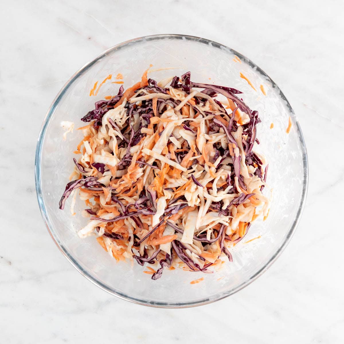Vegan coleslaw mixed in a large bowl