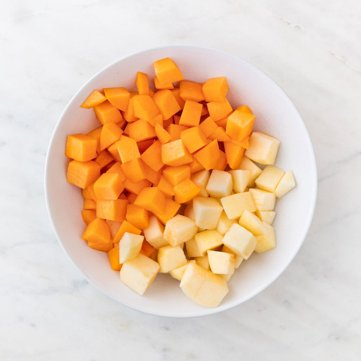 Peeled peaches and apple cut into small pieces for sangria