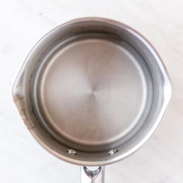 Simple syrup in a small saucepan for homemade sangria