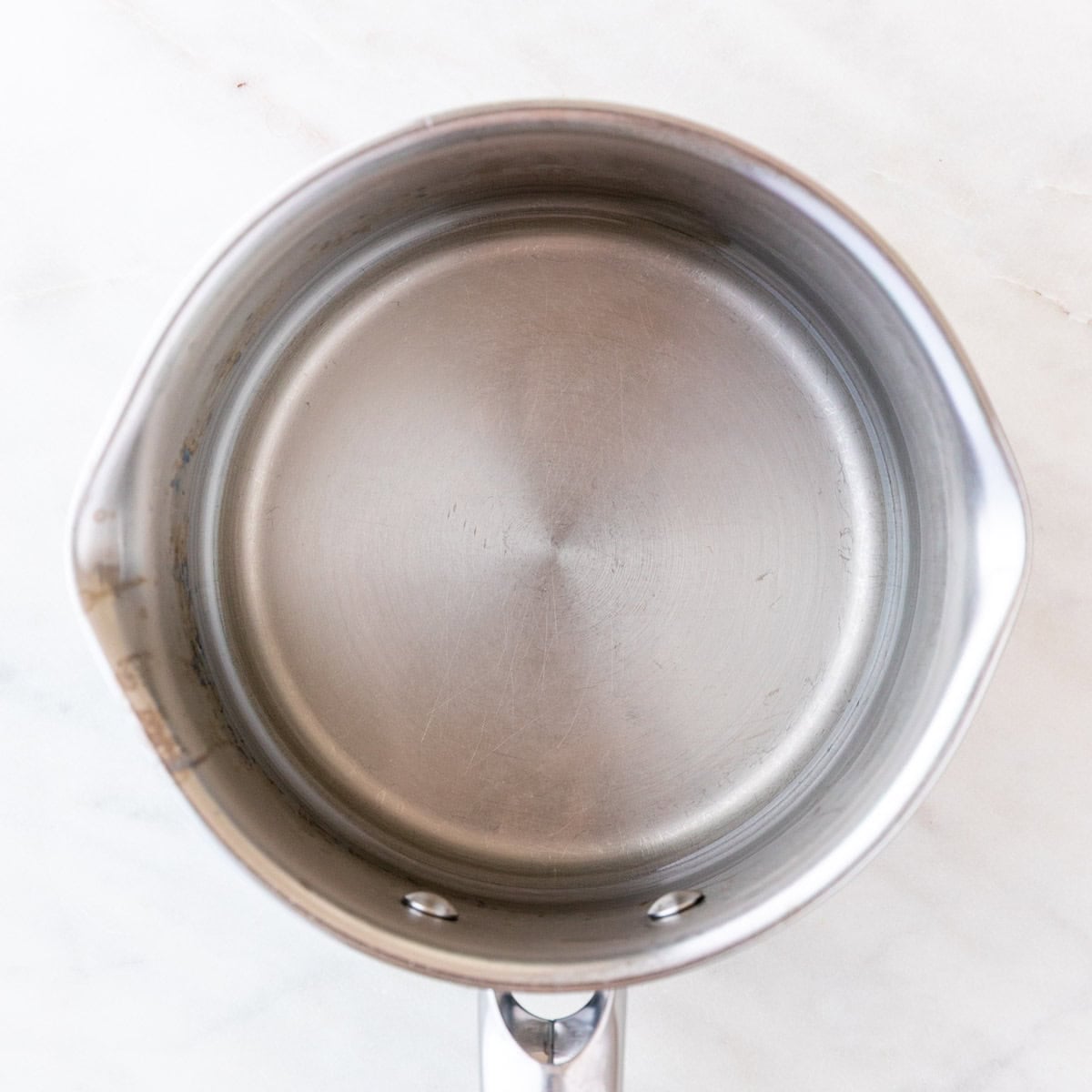 Simple syrup in a small saucepan for homemade sangria
