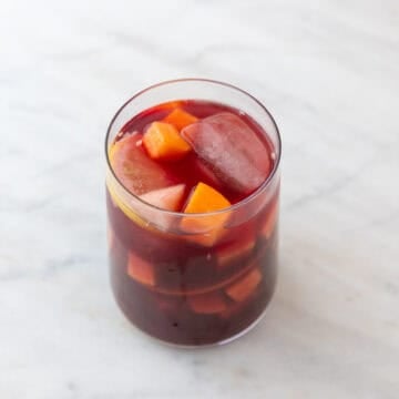 Glass of Spanish sangria with ice and fresh fruit