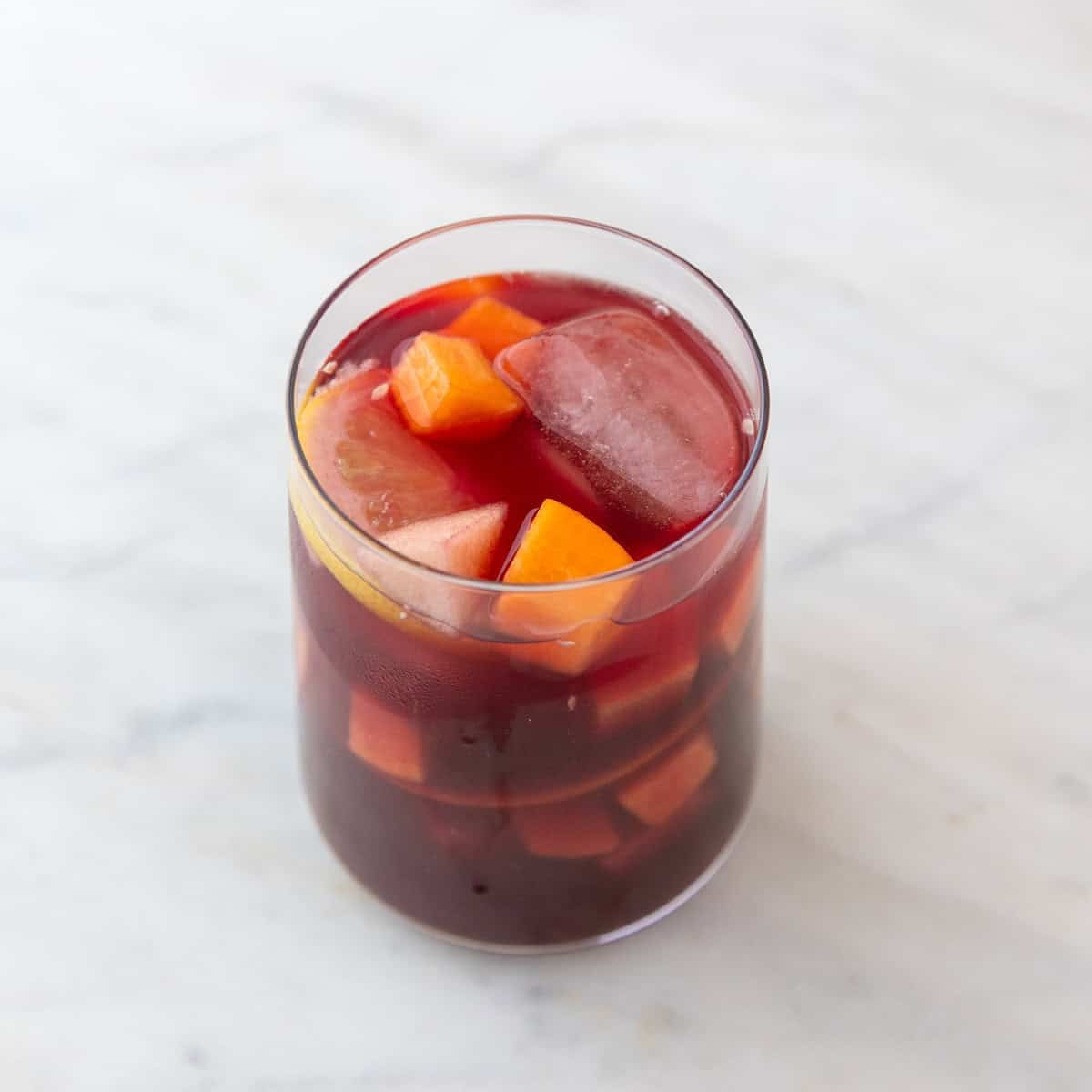 Glass of Spanish sangria with ice and fresh fruit