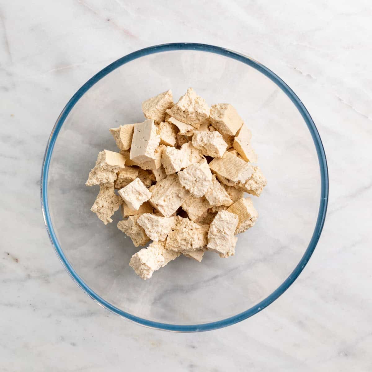 Tofu torn into small bite-sized pieces by hand