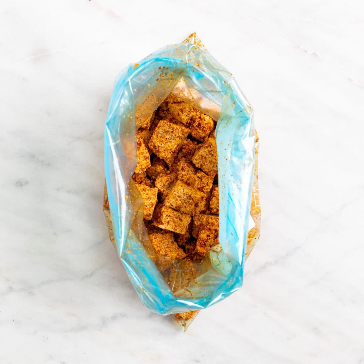 Tofu coated with garlic powder, paprika, salt, and black pepper