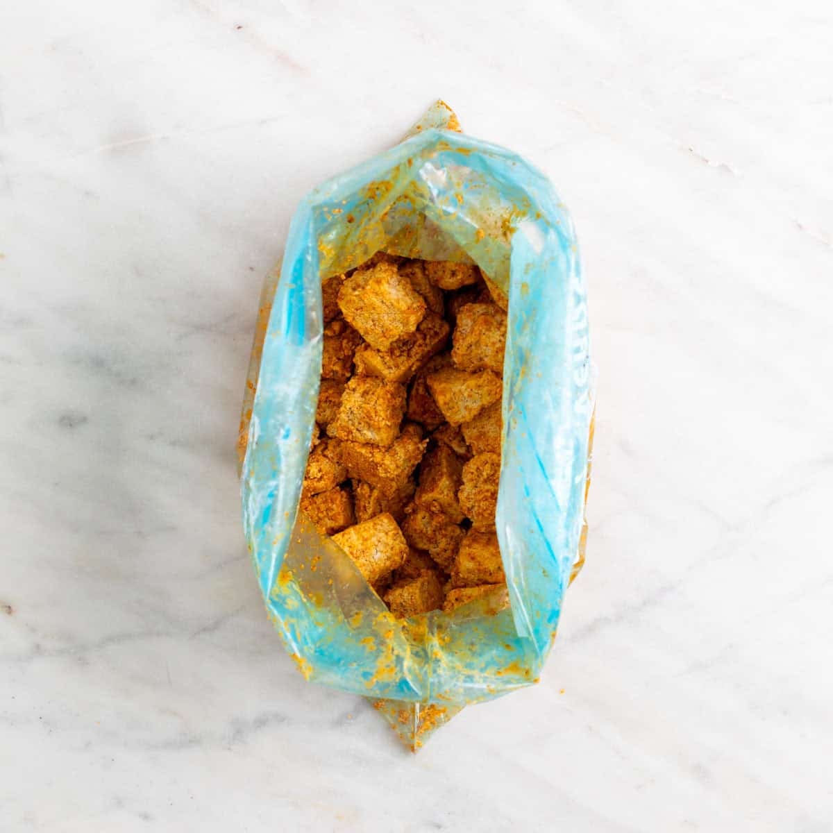 Seasoned tofu coated evenly with cornstarch