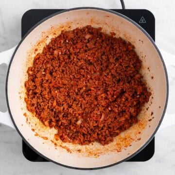 Tomato paste mixed into vegan ground beef