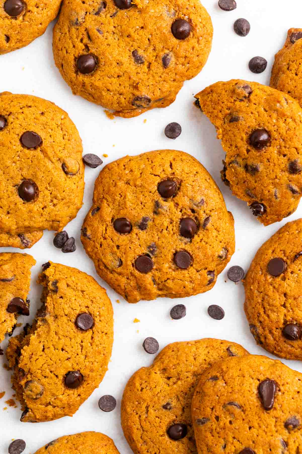 Vegan pumpkin chocolate chip cookies, some whole and some cut in half