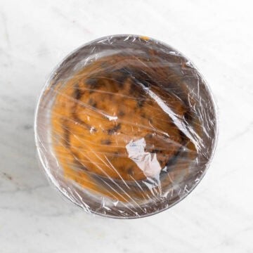 Pumpkin cookie dough covered before chilling