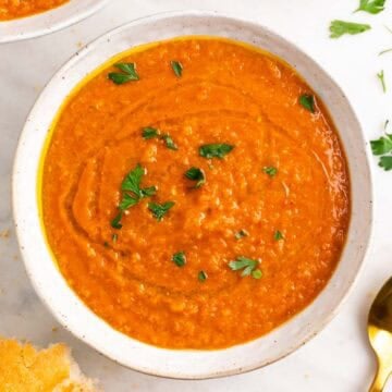 Red lentil soup with bread, parsley, and olive oil