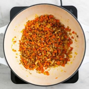 Spices added to the softened vegetables