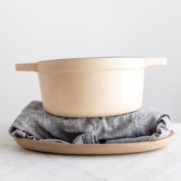 Tofu being pressed to remove excess moisture