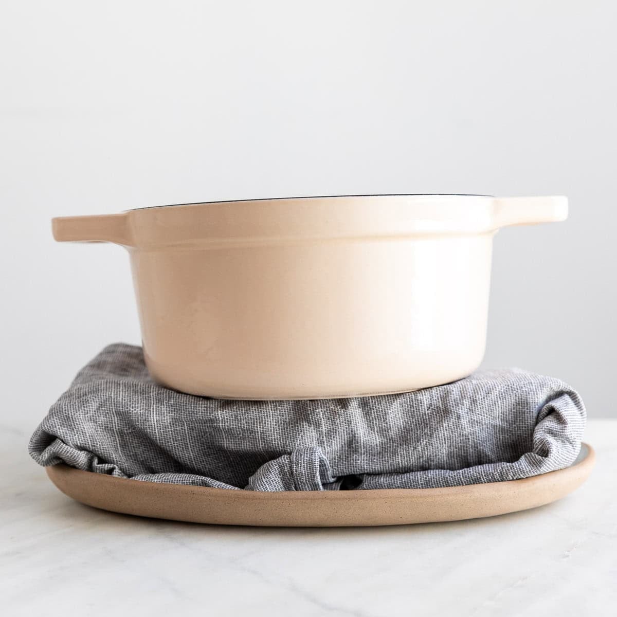 Tofu being pressed to remove excess moisture